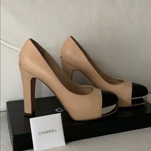 Chanel nude and black pumps